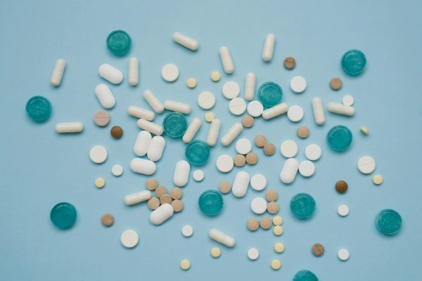 tablets-in-bulk-are-multicolored-on-a-blue-background-the-concept-of-medicine-pharmacy.jpg
